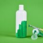 Greenwashing,Concept,With,White,Plastic,Bottle,Being,Painted,Green clean & natural